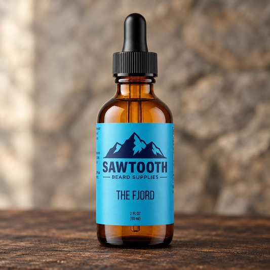 Fjord Beard Oil in its cyan-labeled amber dropper bottle on rustic wood against a stone backdrop